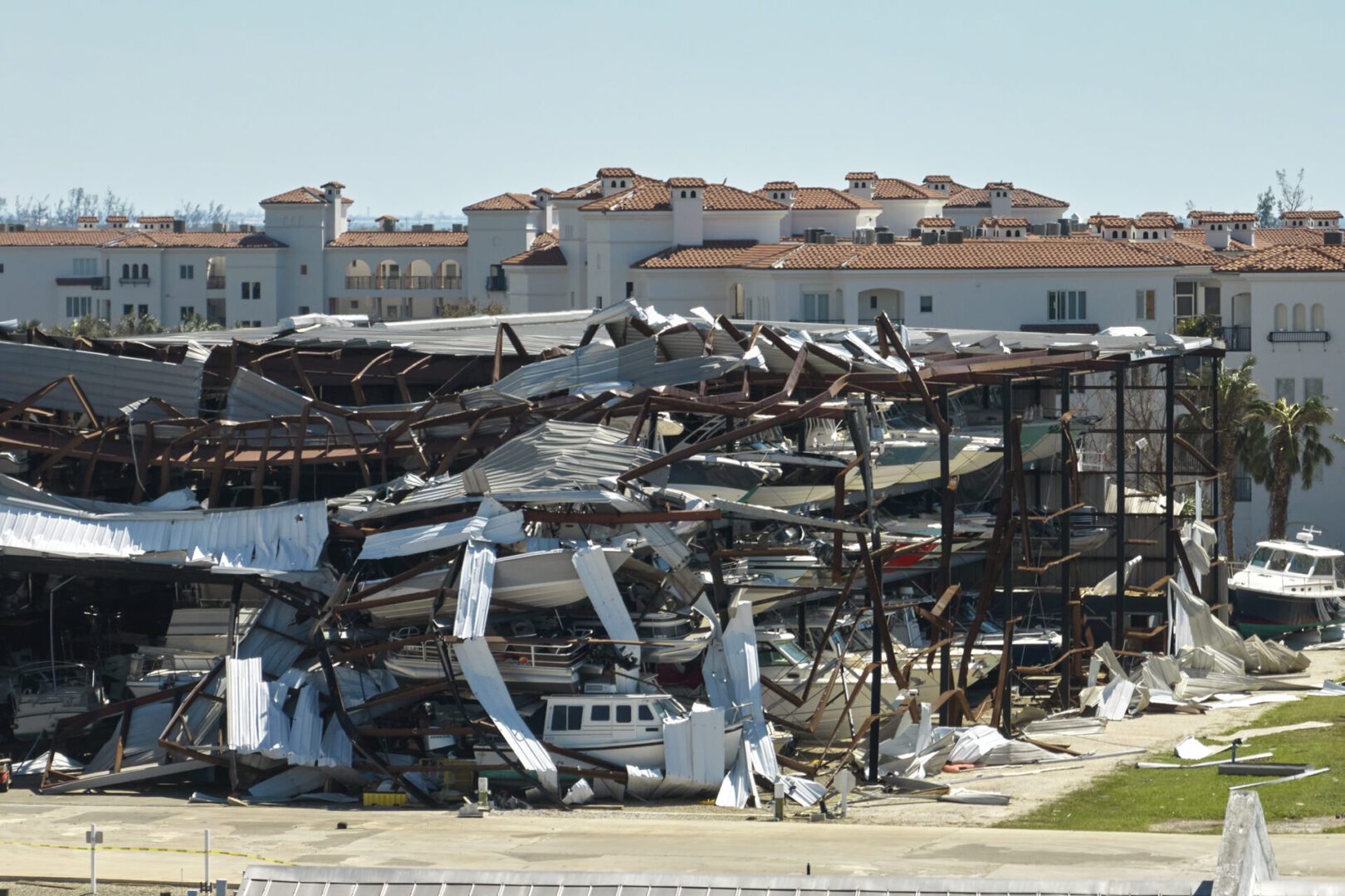 Hurricane Ian destroyed boat station in Florida coastal area. Natural disaster and its consequences.